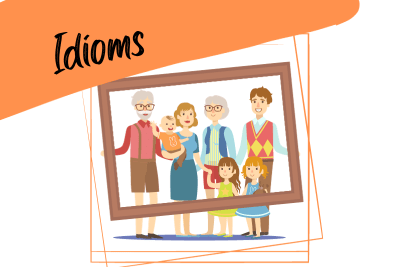 happy big family holding a frame, and the word "idioms"